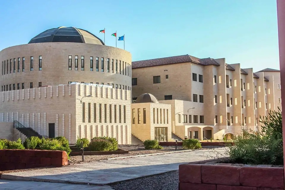 A large domed building with flags